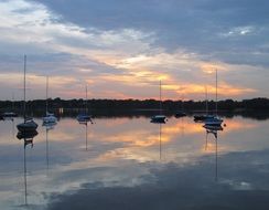 Sailing boats on the lake at beautiful and colorful dusk in Dallas, Texas