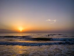 fisherman on a boat at sunrise