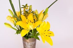 bouquet of yellow lilies in a vase close-up