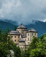 beautiful view of the big castle in the forest near the mountains, Austria