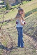girl with long hair in a pose half-turned