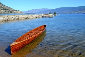 war canoe on the lake on a sunny day