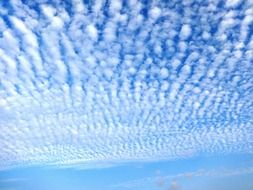 cirrus white clouds in a bright blue sky