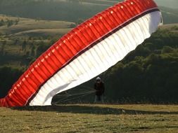 Person with the white and red parachute