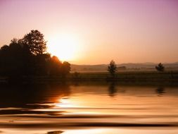 evening sun is reflected in the water