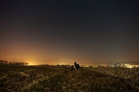 boy looking at stars at night