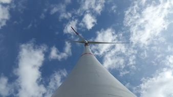 pinwheel on wind power turbine at sky, bottom view