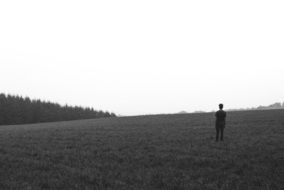 lonely man on the empty field