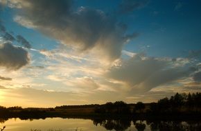 a photo quiet sunset over the water