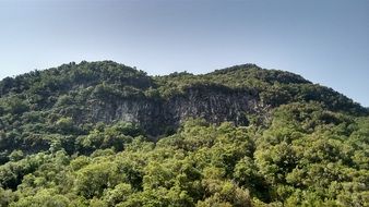 rocks among green hills