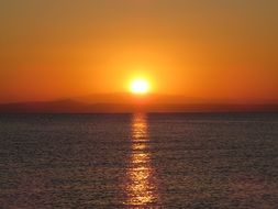 orange sunrise over the pond