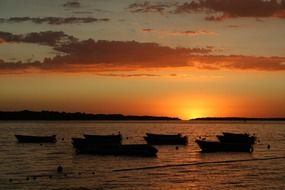 fishing boats at sunset