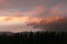 pink sunset over coastal landscape