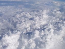 white fluffy clouds in the atmosphere