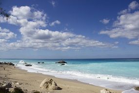 white clouds over a picturesque beach