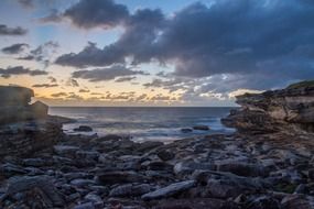 landscape of a small bay at sunset