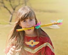 girl in Indian costume playing outside