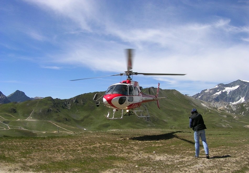 Picture of the helicopter in a valley in the alps