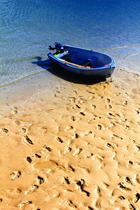 Boat on the sand on a sunny day