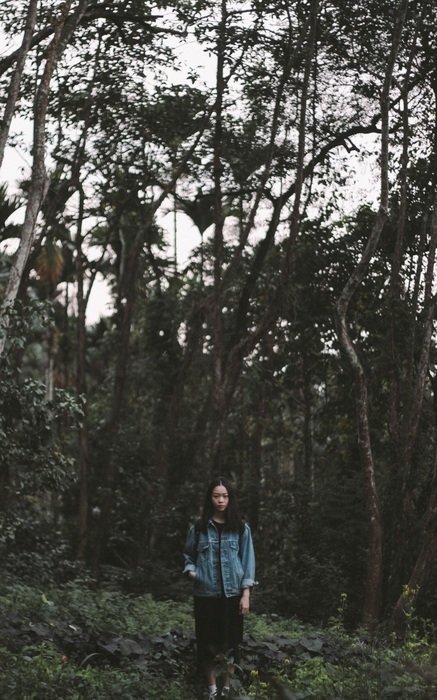 Young girl in the forest on vacation