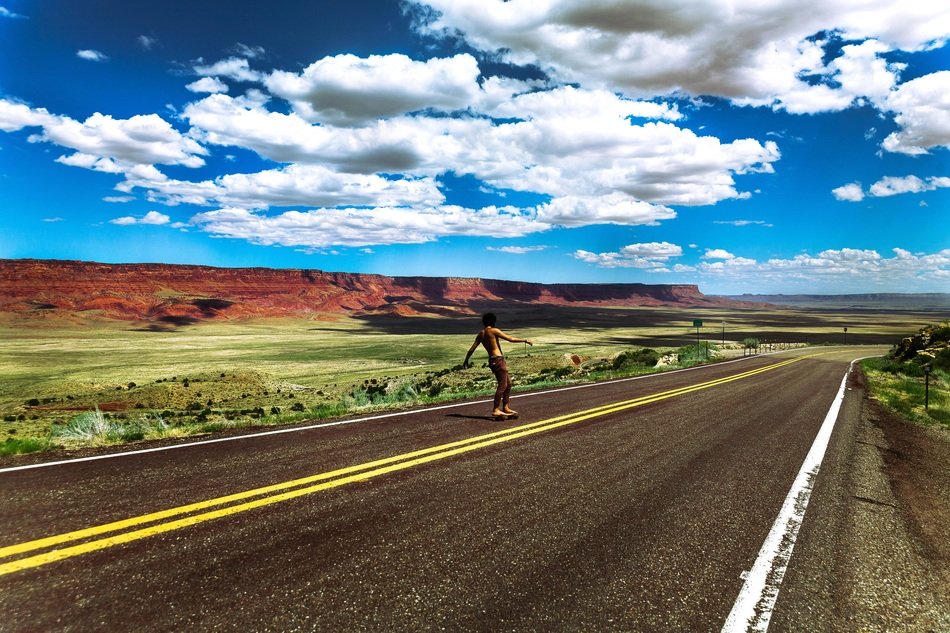 skateboarder on an empty road