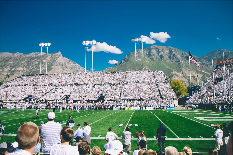 audience in the stadium watching the championship in American football