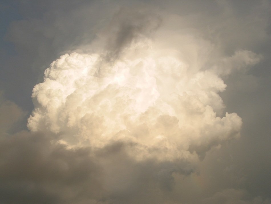 sun lights through cumulonimbus raincloud