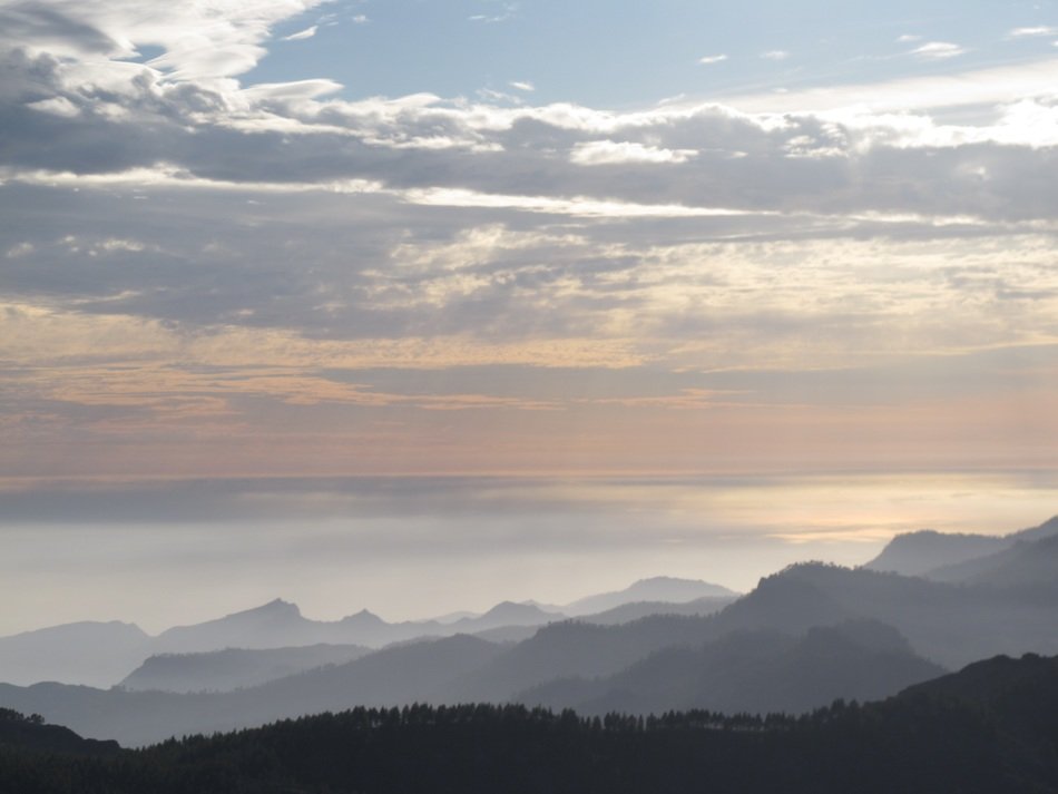 mountain landscape with sunset in the fog