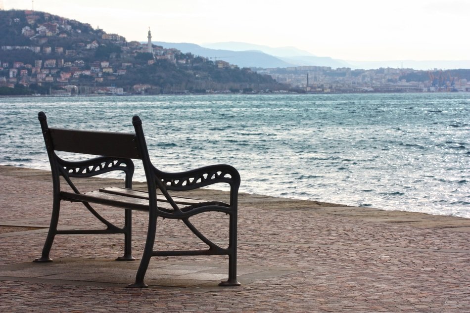 bench by the sea on the sandy beach