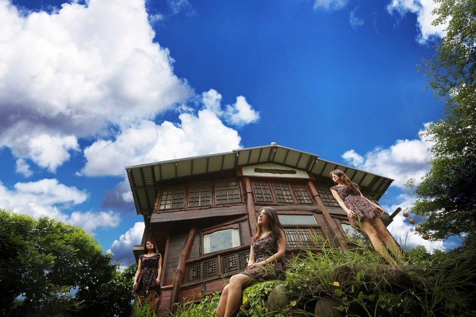 three women near house face sky view