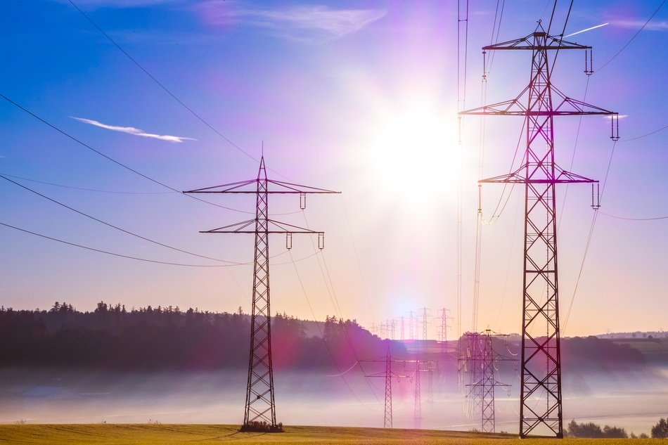 power lines against the sun