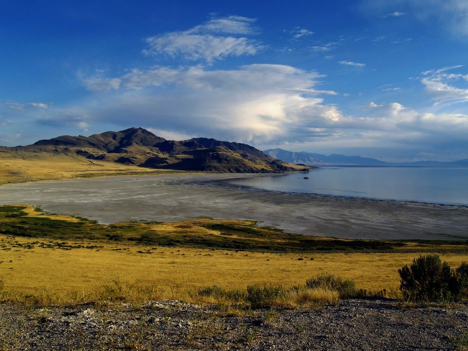 Landscape of beautiful Great Salt Lake among the colorful fields in Utah