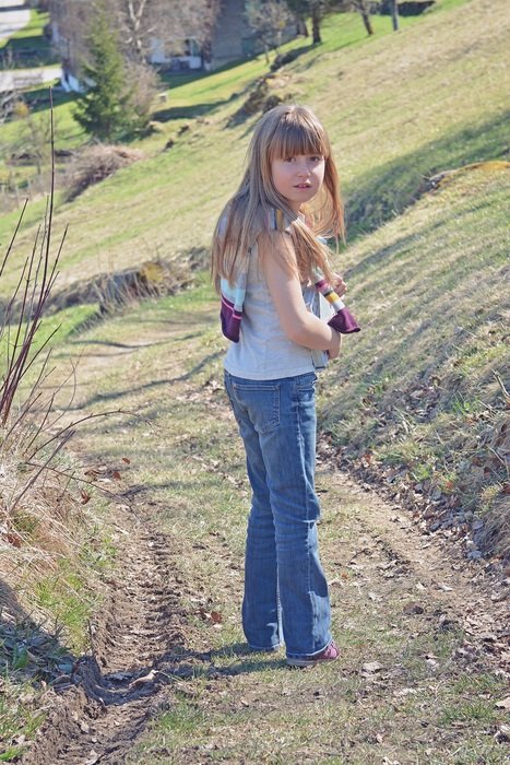 girl with long hair in a pose half-turned