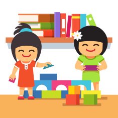 Asian children playing building tower together