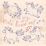 Drawing young horses on notebook sheet