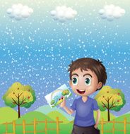 Happy child holding picture with a rainbow