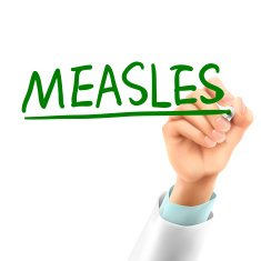 doctor writing measles word