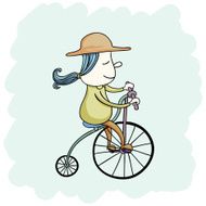 Little girl riding on a bicycle