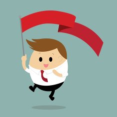 Businessman holding and waving a red flag