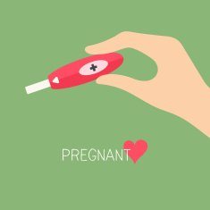 Female hand holding pregnancy test
