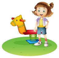 Girl standing beside a horse spring toy