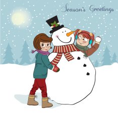 two happy girls building a snowman N5