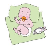 Sleeping baby with a toy rabbit