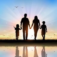 Happy Family with children walking at sunset time