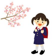 School girl with blooming cherry blossoms