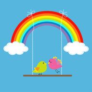 Rainbow two clouds in the sky and birds on swing