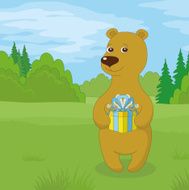 Teddy bear with gift on meadow