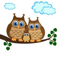 Family of owls sat on tree branch