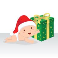 Cute baby boy with Christmas gift