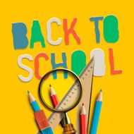 Welcome back to school on yellow background